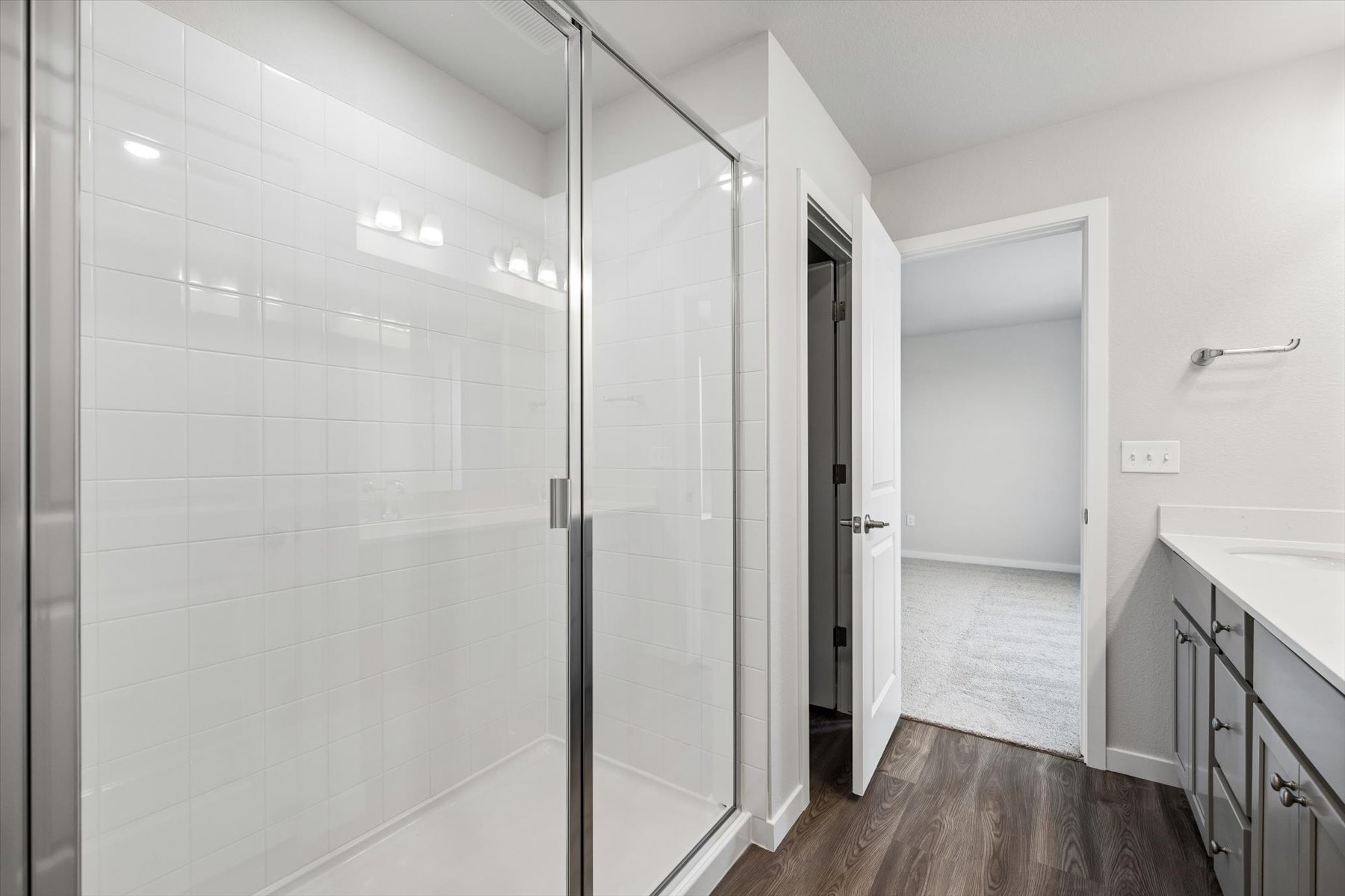 A bathroom with a shower unit.
