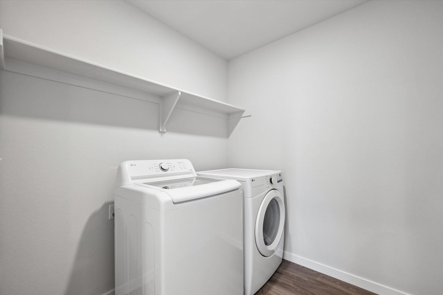 A white washing machine in a room.