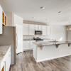 Open concept kitchen of the ranch style Palisade plan by Century Communities