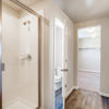 Primary suite shower, bathroom, and closet of the Fraser floor plan by Century Communities