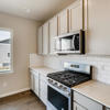Kitchen counters and appliances of the two-story Lewis plan by Century Communities