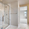 Primary suite's private shower and dual vanity of the two-story Lewis plan by Century Communities