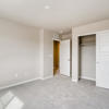 Secondary bedroom with sliding closet of the two-story Lewis plan by Century Communities