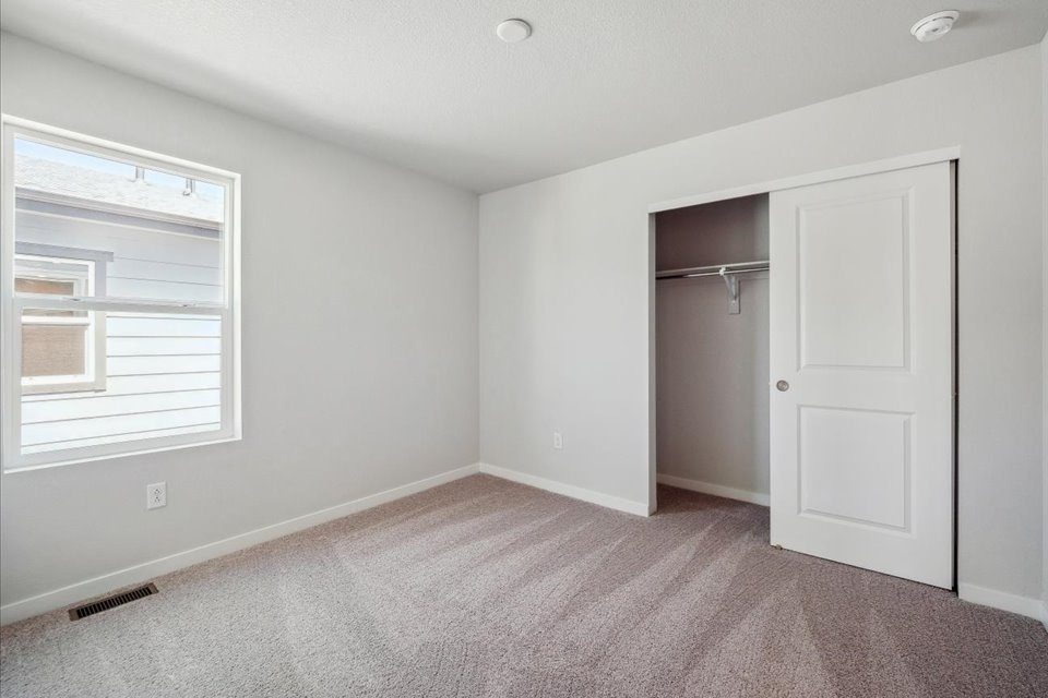 A room with a door and a window.