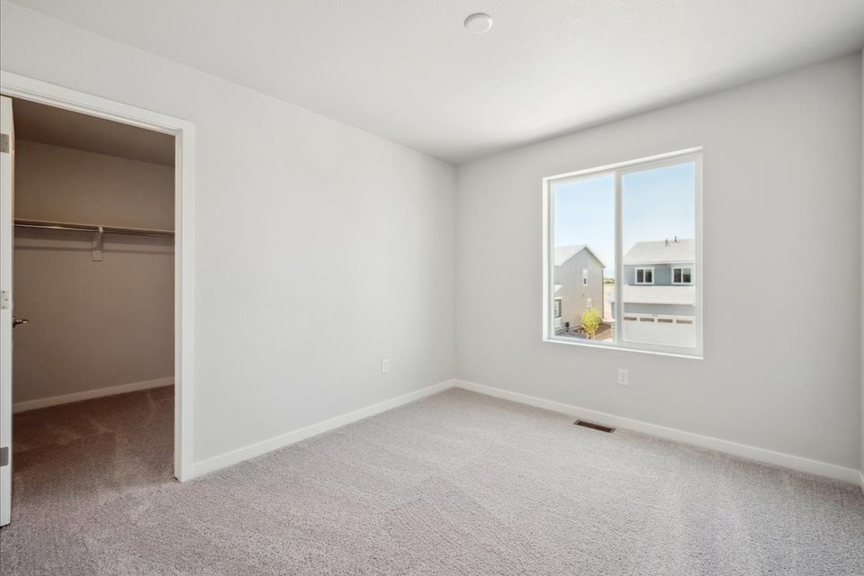 A room with a window and a door.