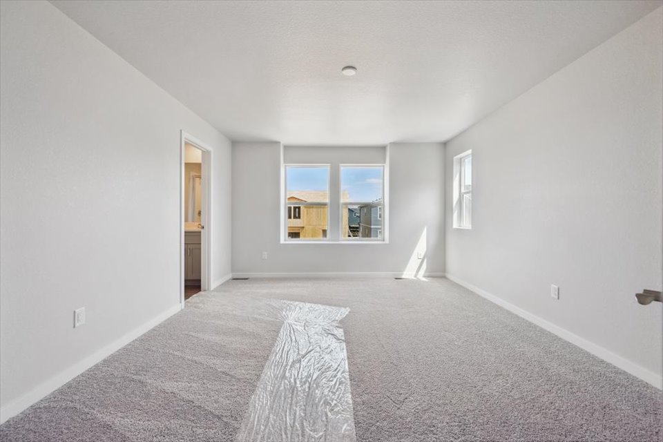 A large empty room with a window.