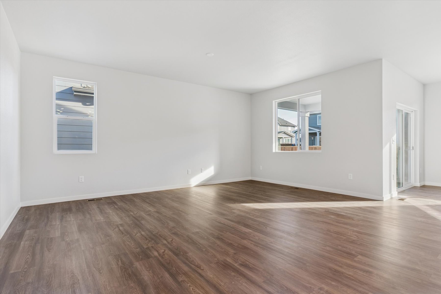 A room with a wood floor and a wood floor.