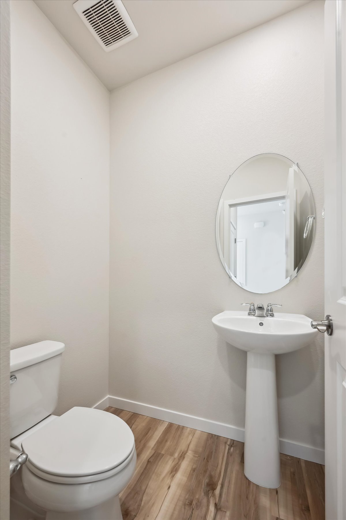A bathroom with a sink and toilet.