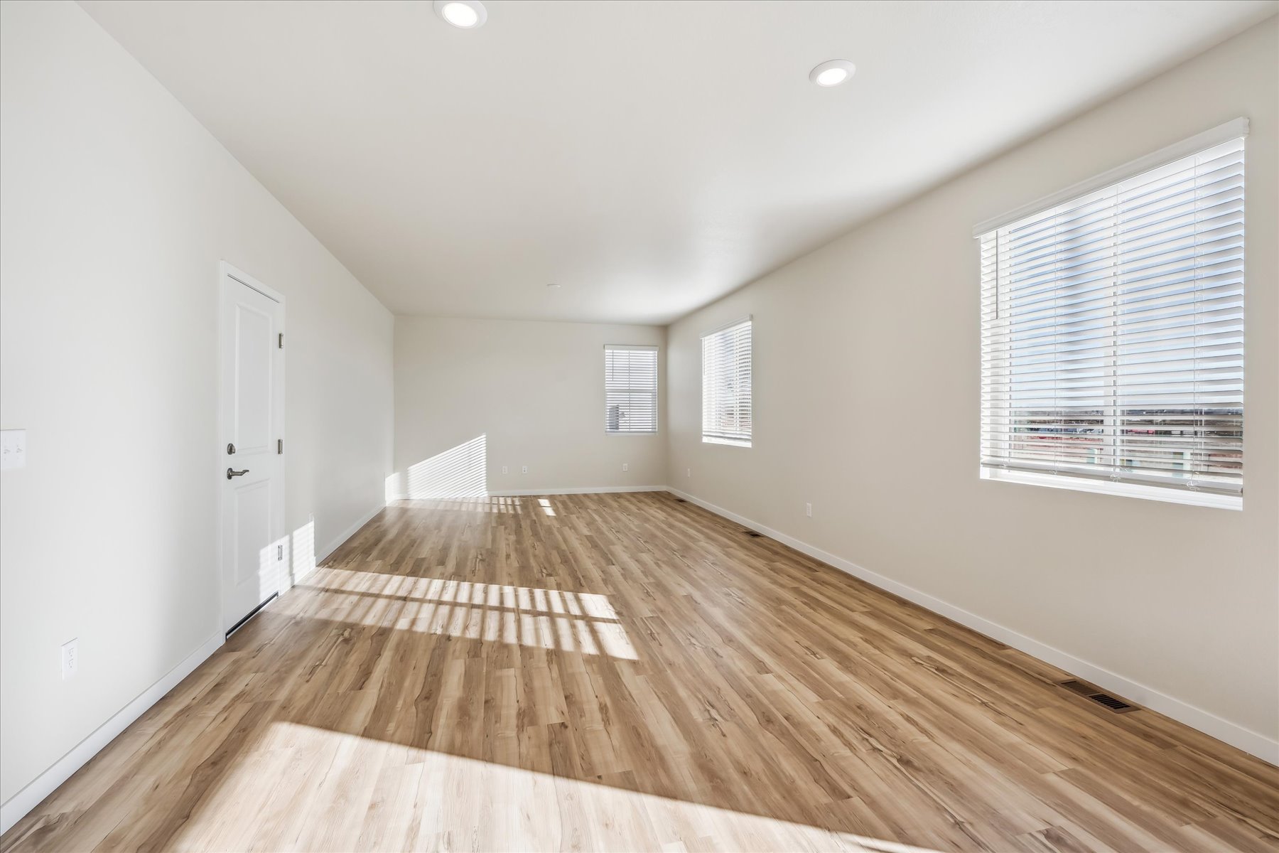 A room with a wood floor and a wood floor.