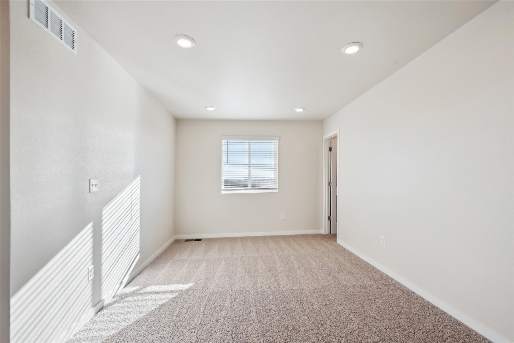 A hallway with a window.