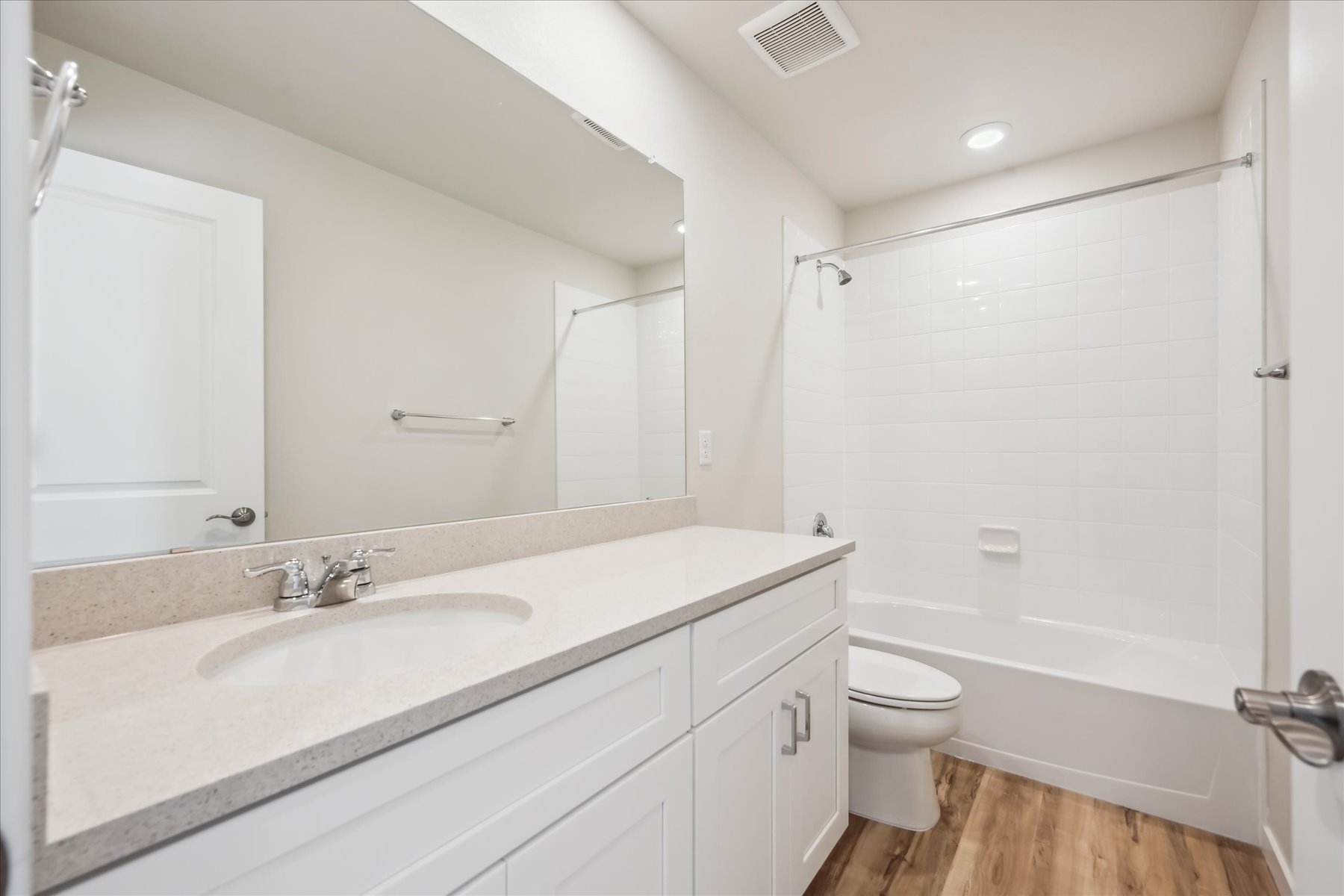 A bathroom with a sink toilet and shower.