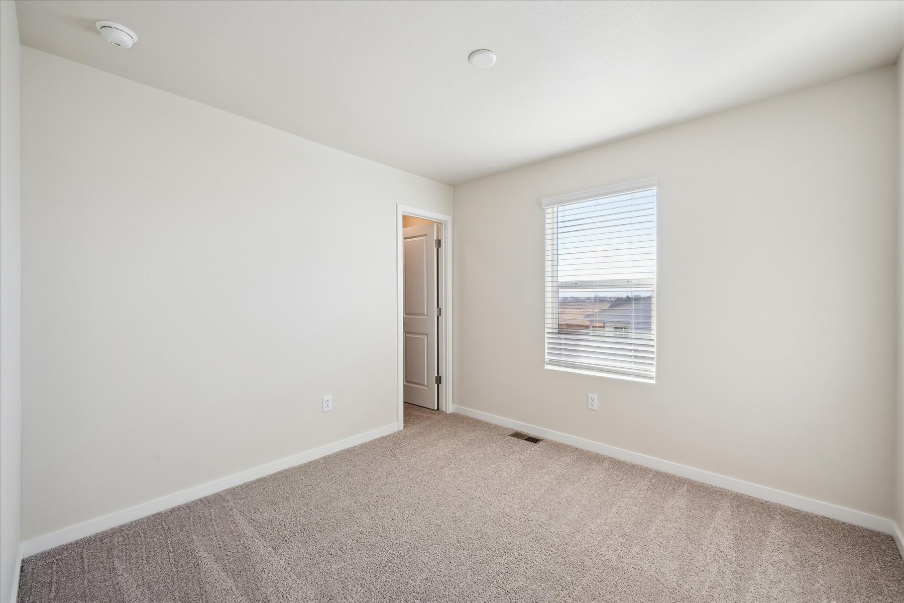 A room with a door and a window.