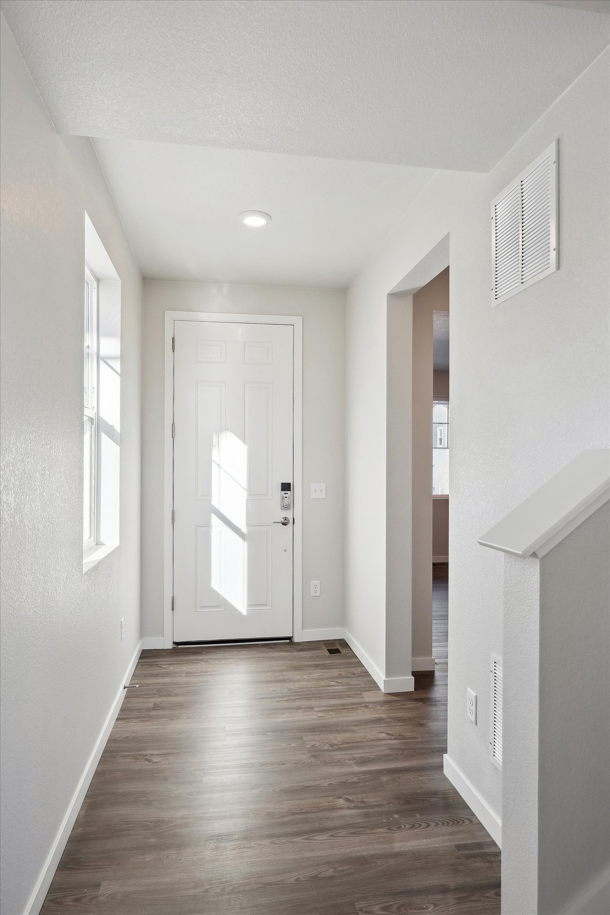 A hallway with white doors.