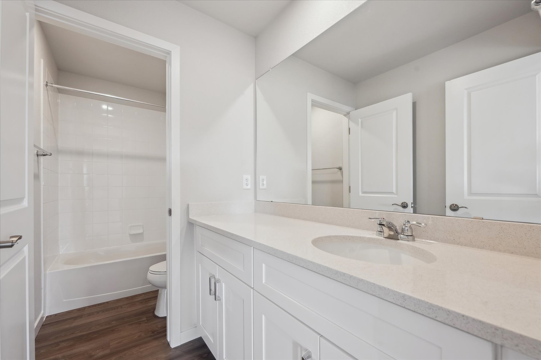 A bathroom with a sink and a toilet.