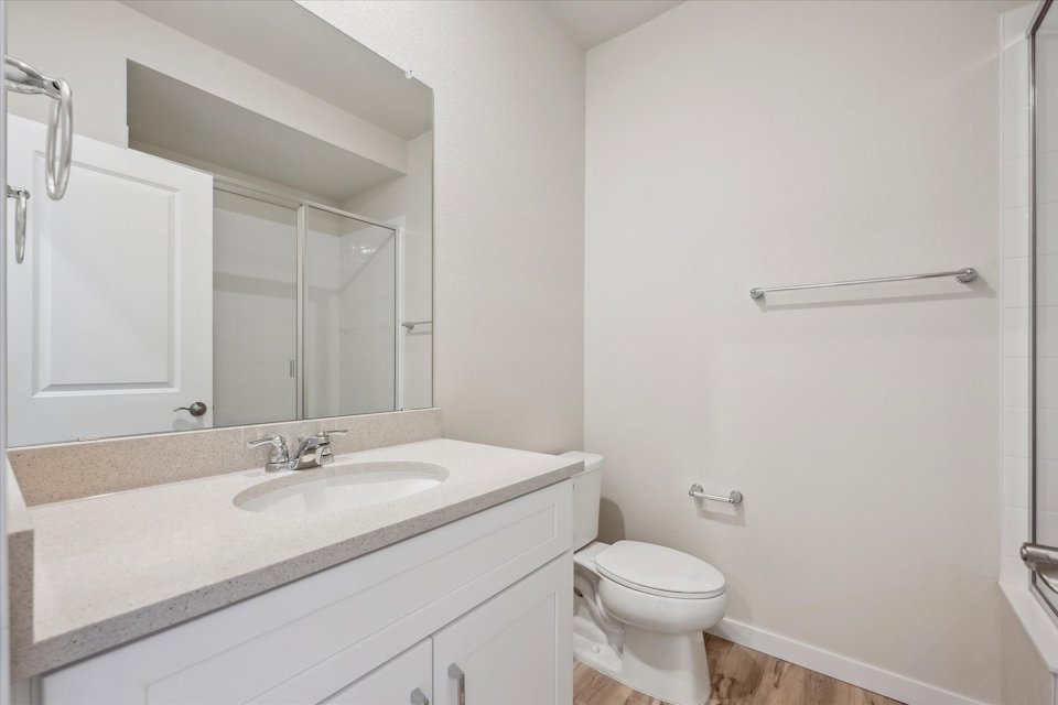 A bathroom with a sink and toilet.