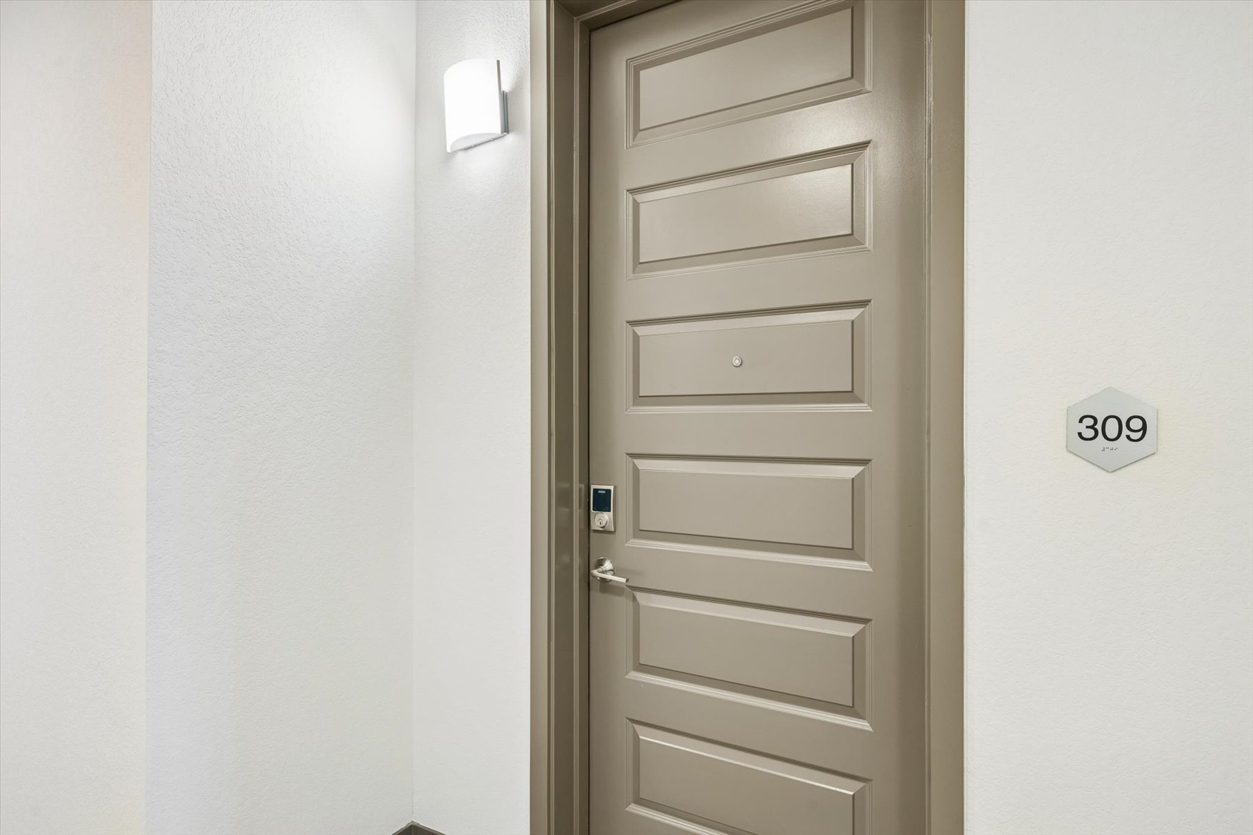 A door with a light above it.