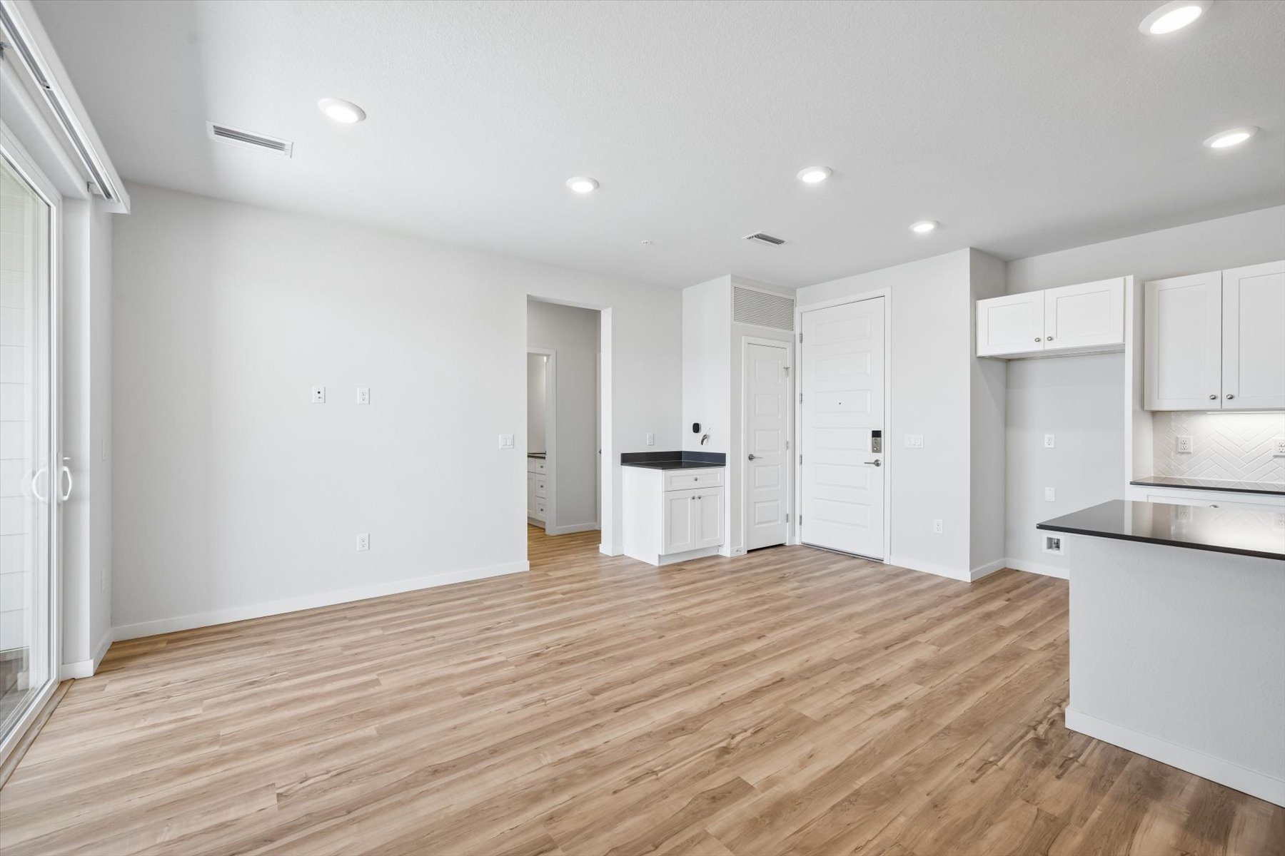 A room with white cabinets.