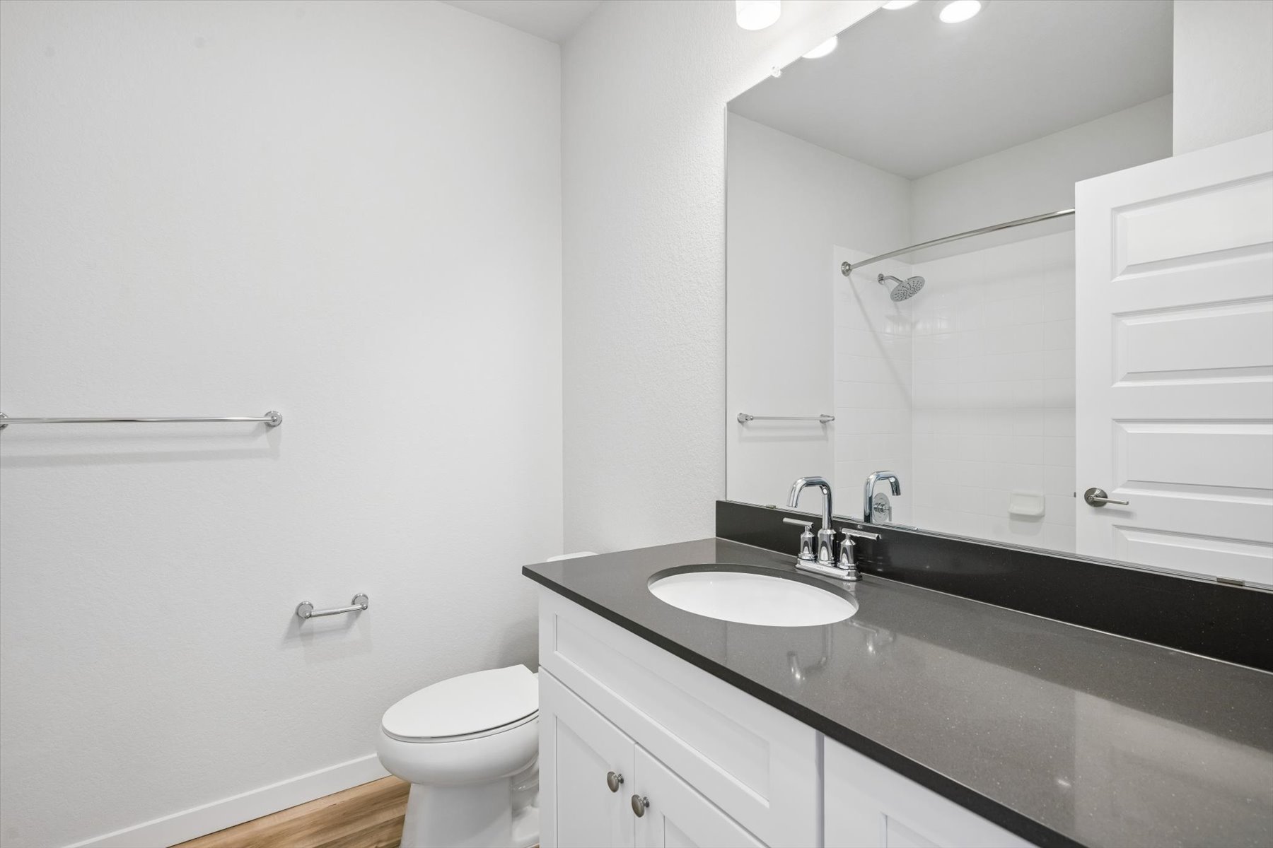 A bathroom with a sink and a toilet.