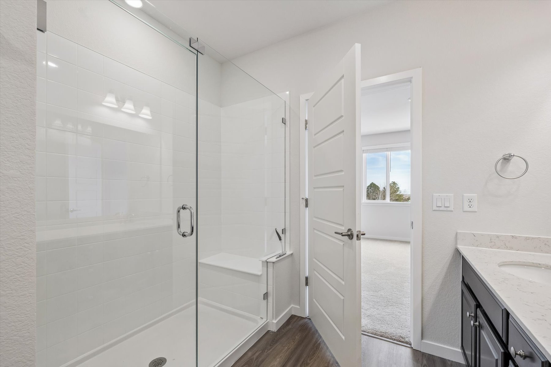 A bathroom with a glass shower.
