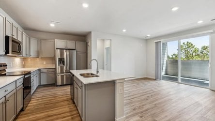 A kitchen with wooden floors.