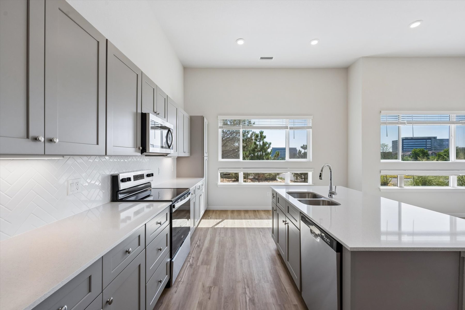 A kitchen with black cabinets.