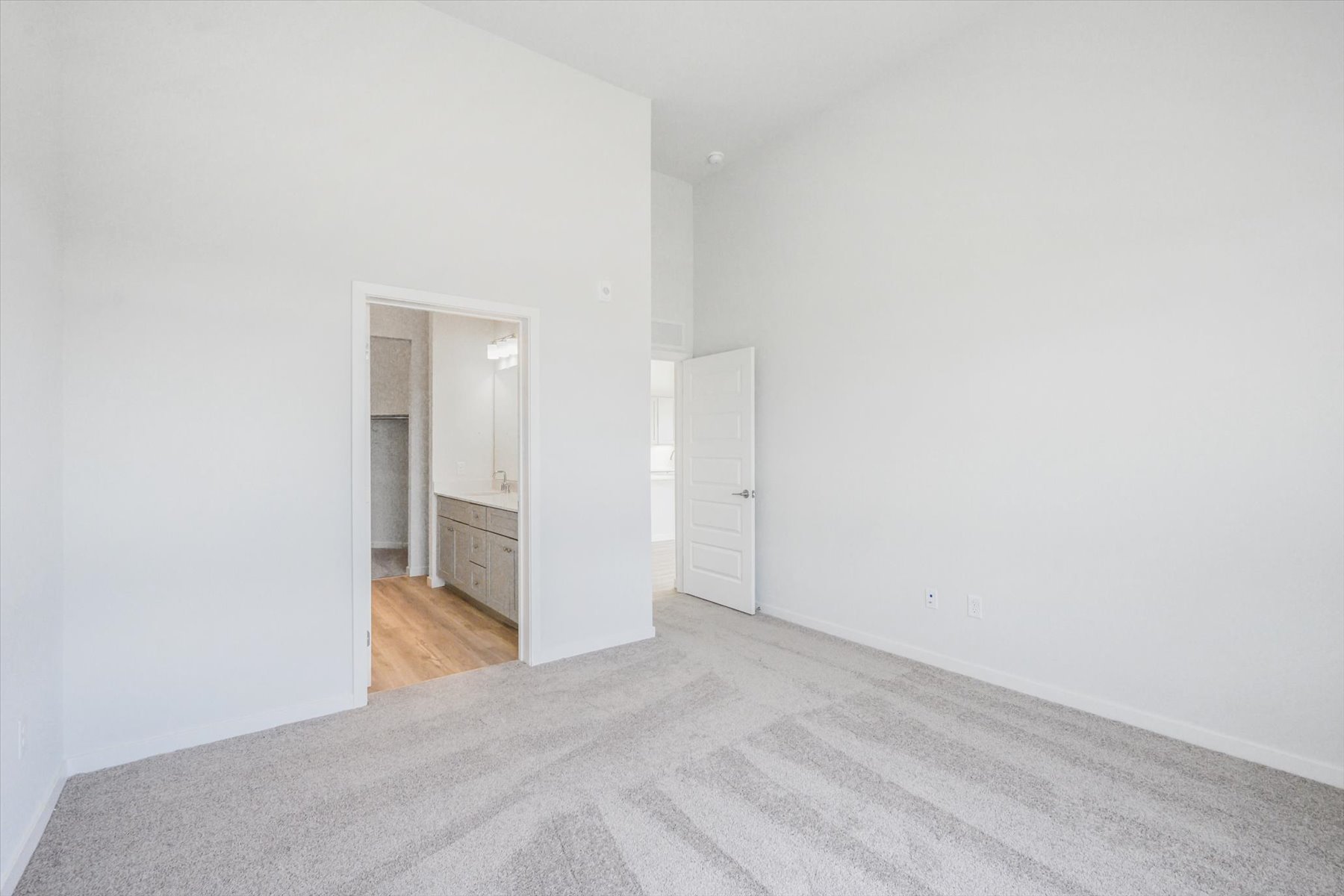 A hallway with white walls.
