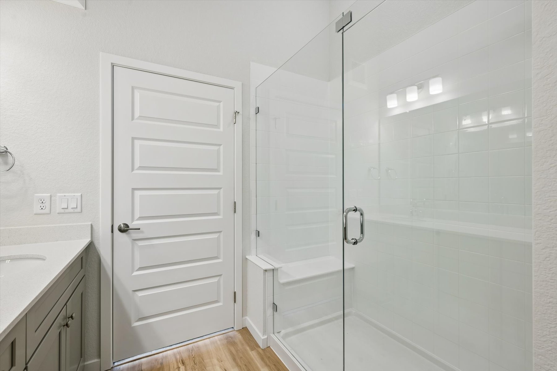 A bathroom with a glass shower.