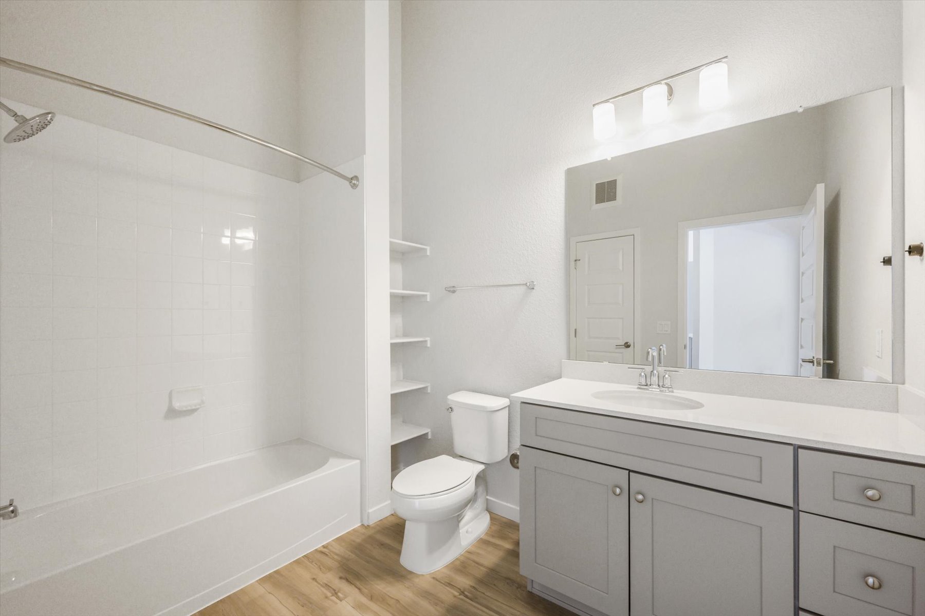 A bathroom with a toilet and sink.