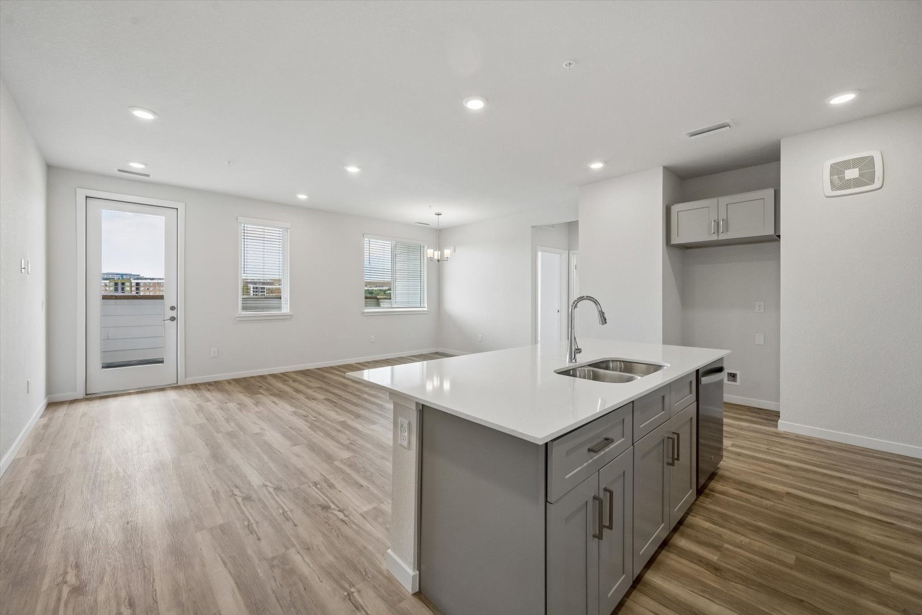A kitchen with wooden floors.