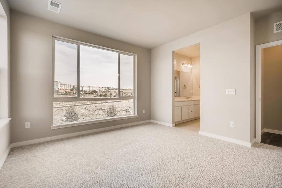 A room with a large window.