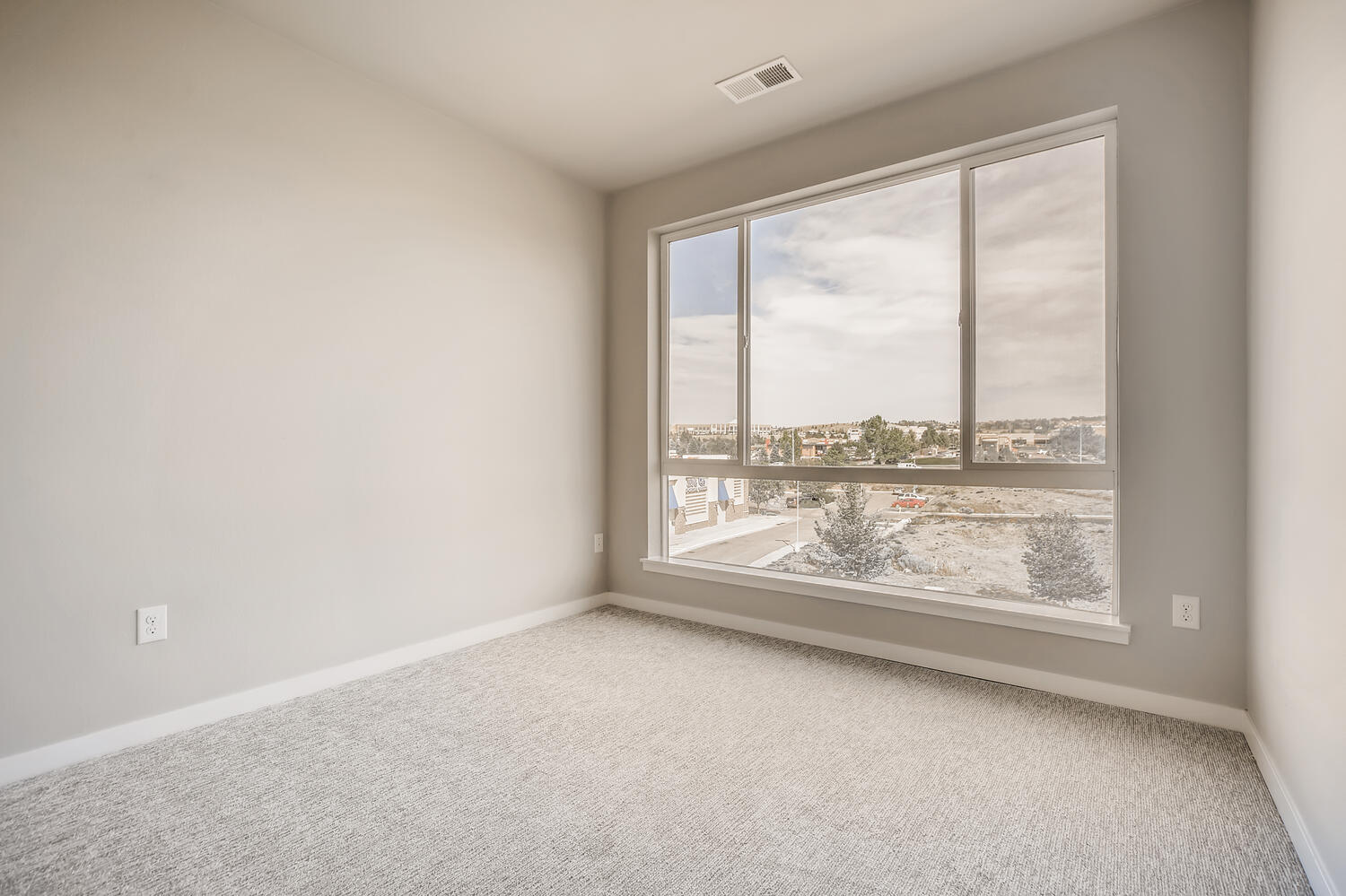 A room with a large window.