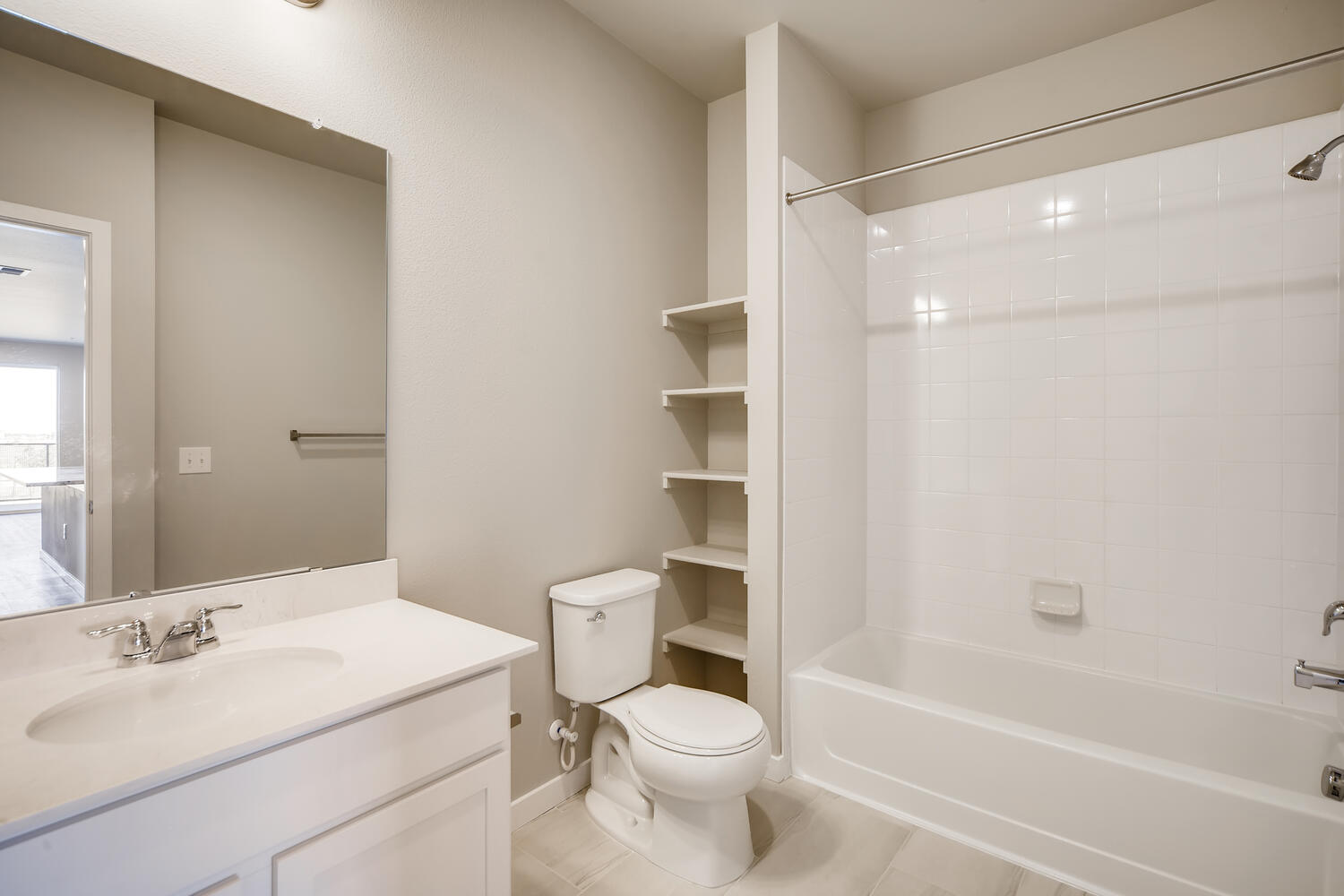 A bathroom with a toilet and sink.