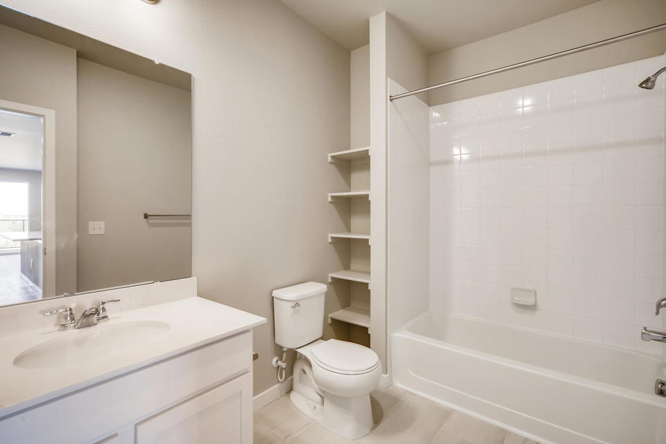 A bathroom with a toilet and sink.