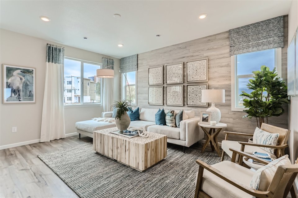 A living room with a couch and a table.