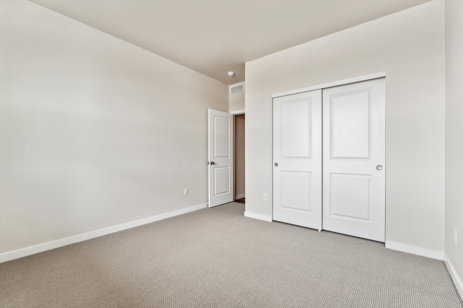 A room with white doors.