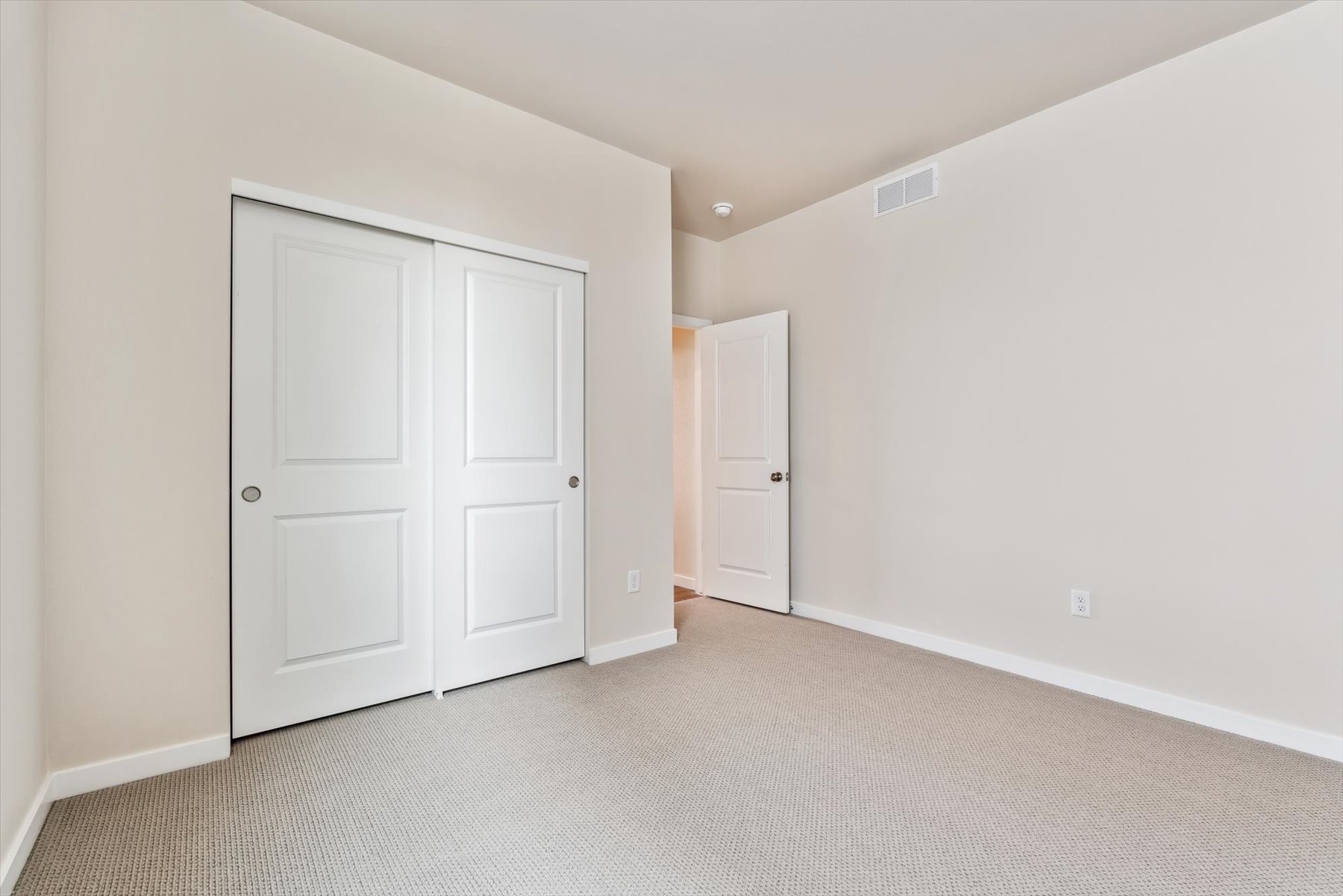 A room with white doors.