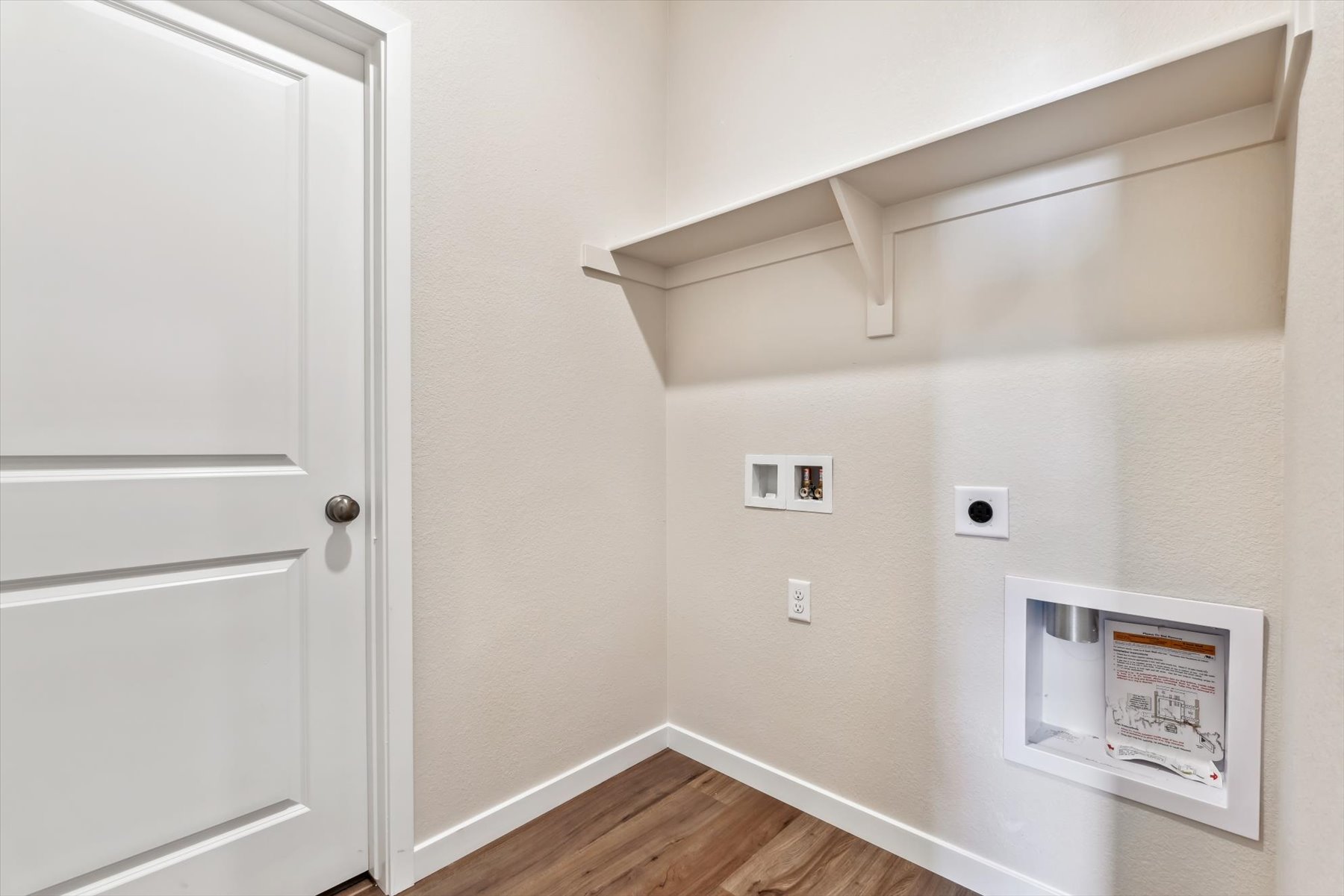 A white door with a sign on it.