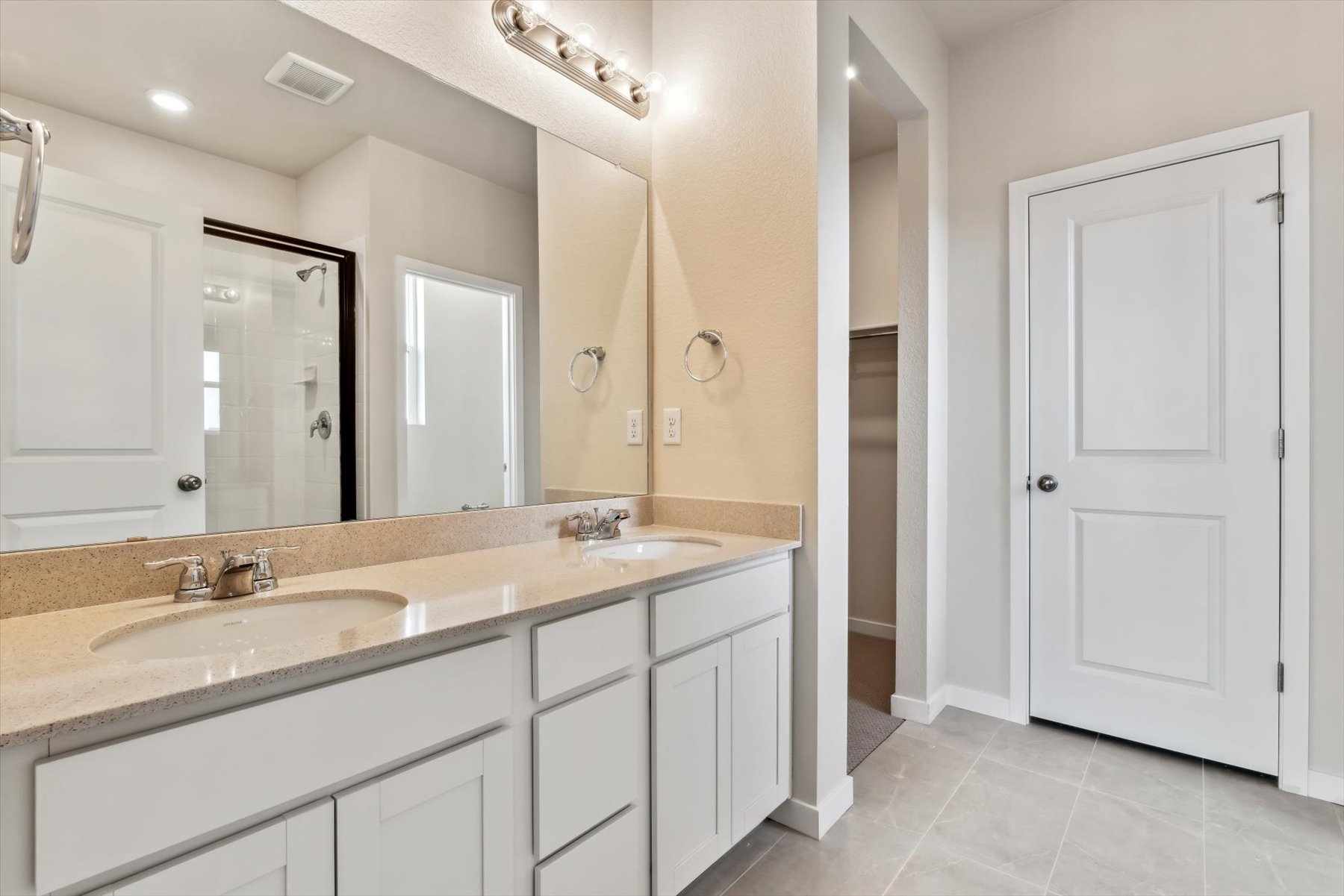 A bathroom with a marble countertop.