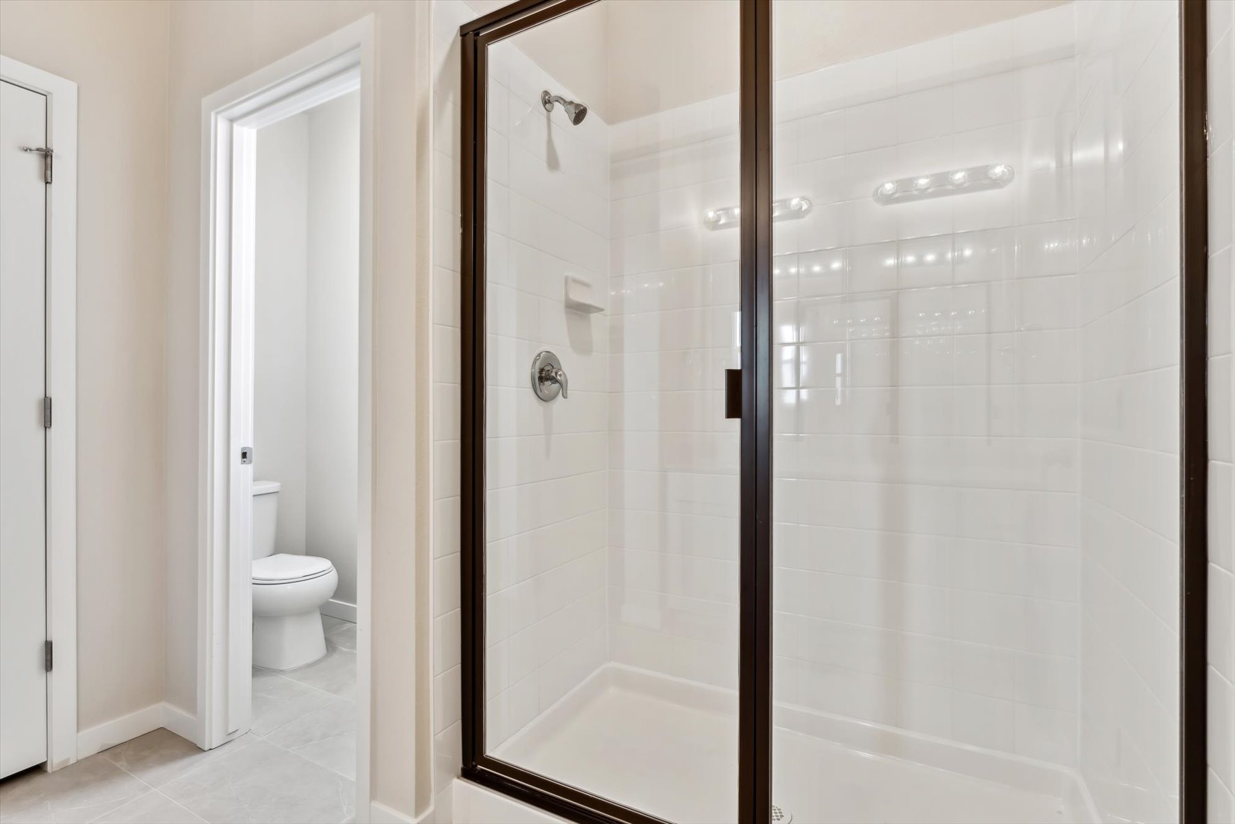 A bathroom with a glass shower.