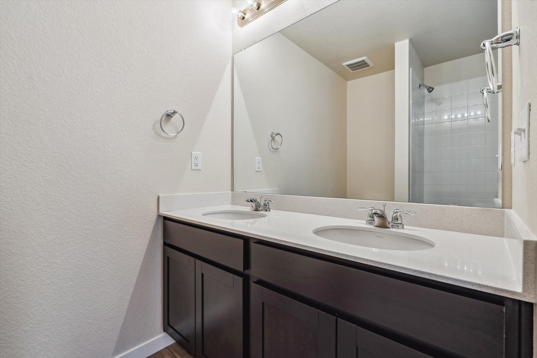 A bathroom with two sinks.