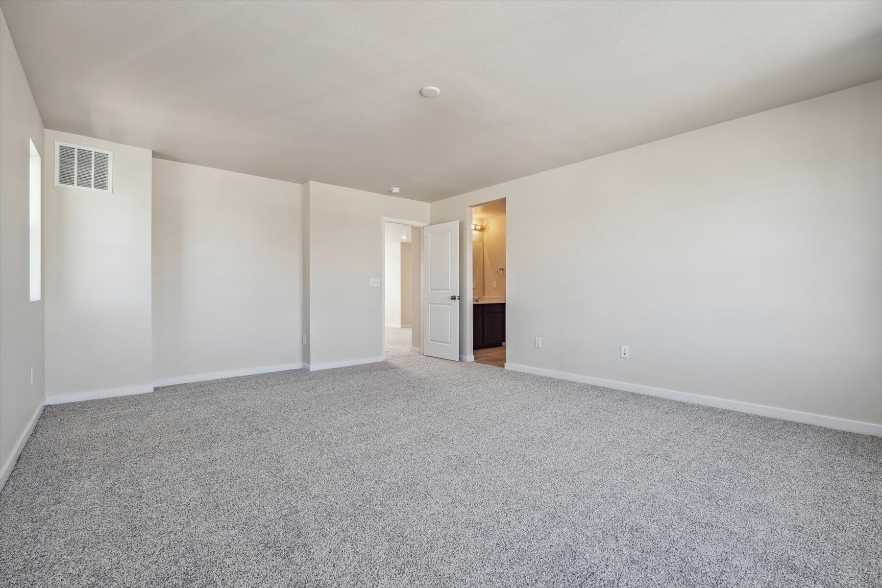 A long hallway with white walls.