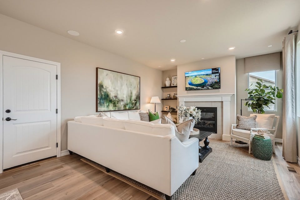 A large living room with a fireplace.