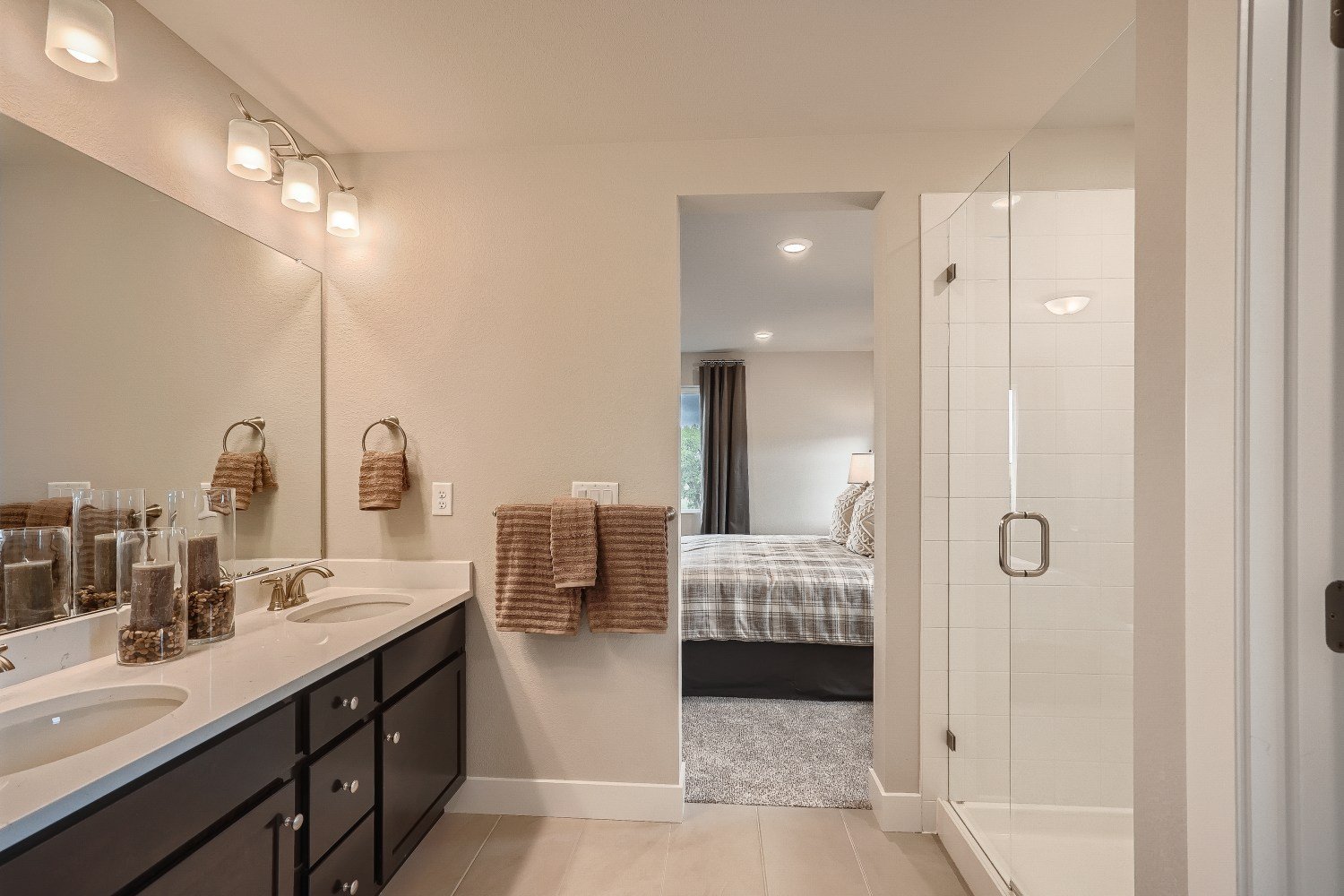 A bathroom with a tub sink and a shower.