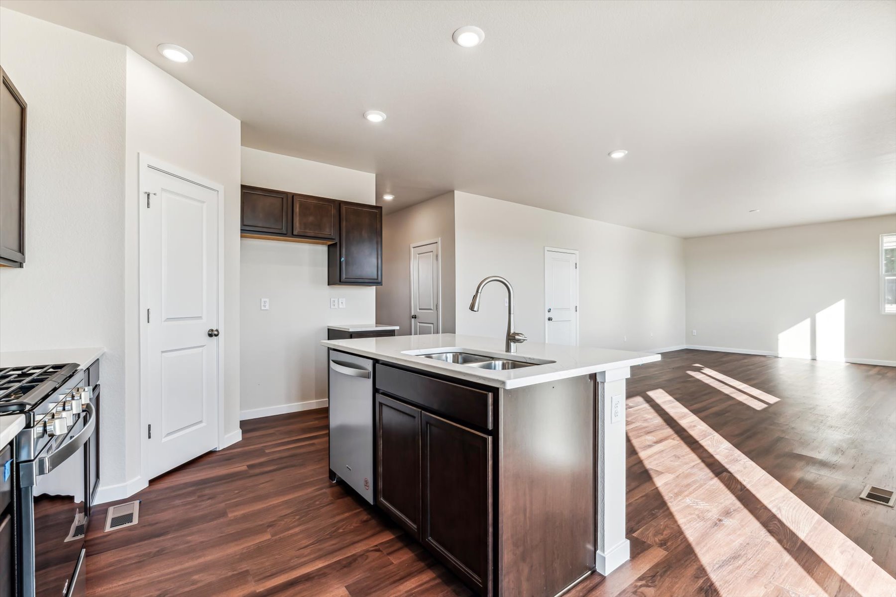 A kitchen with black appliances.