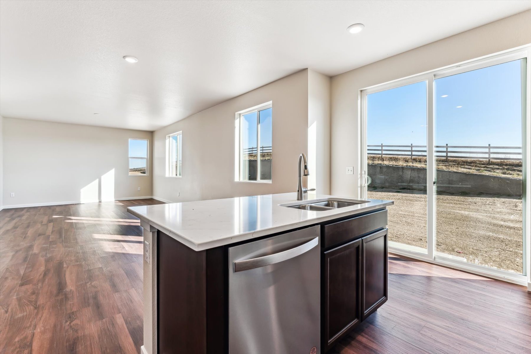A kitchen with a large window.