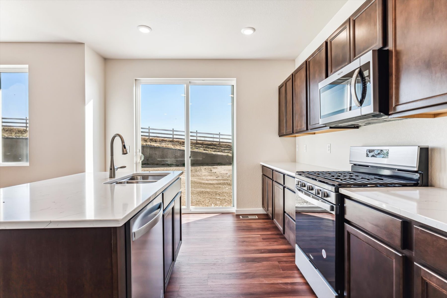 A kitchen with black appliances.