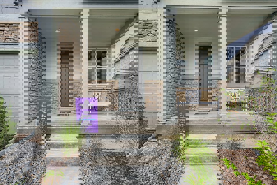 A house with a sign in front.