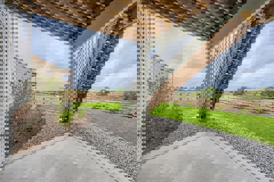 A concrete walkway with a roof.