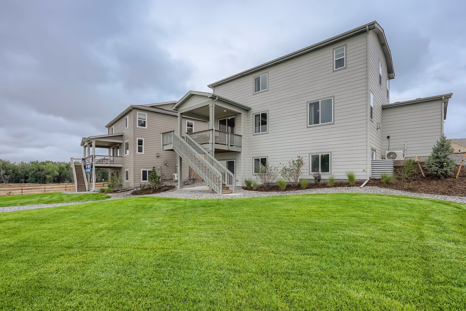 A house with a lawn in front of it.