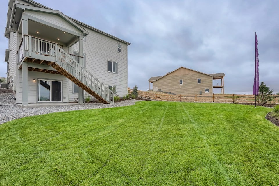 A house with a grass yard.